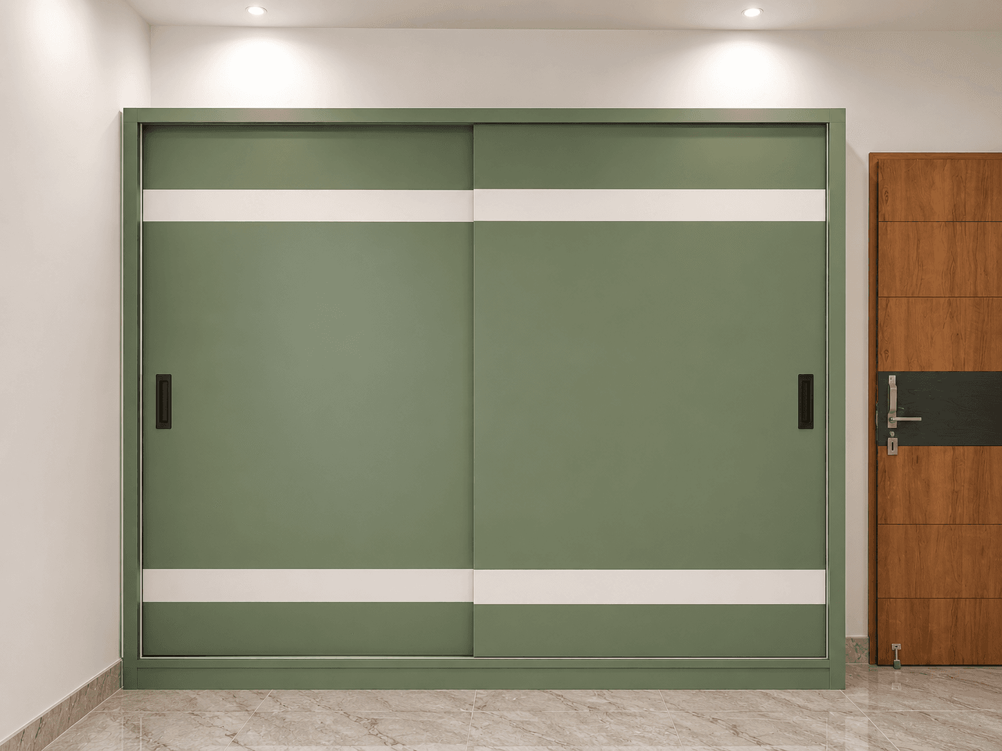A sage-green sliding wardrobe with a clean two-tone finish