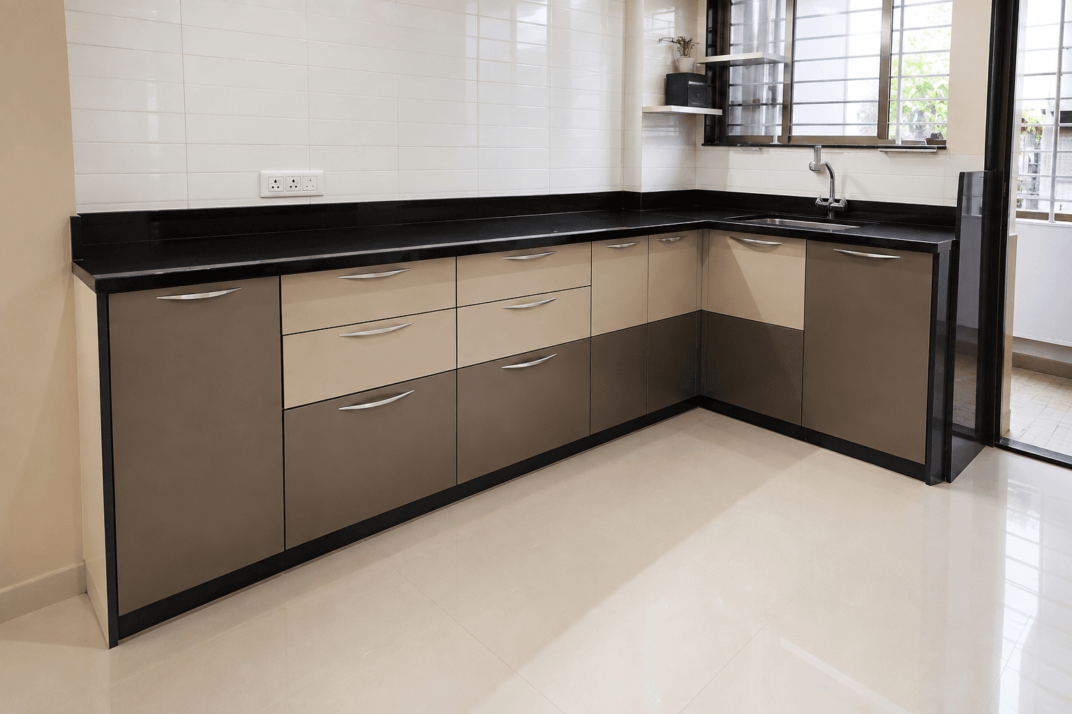 A two-tone modular kitchen with black granite countertops